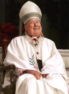 Cardinal O'Connor laughs as people sing Happy Birthday to him